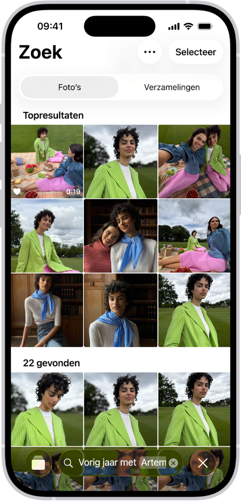 Een iPhone met foto's in de Foto's-app. Onder in het scherm staat een zoekbalk met een beschrijving.