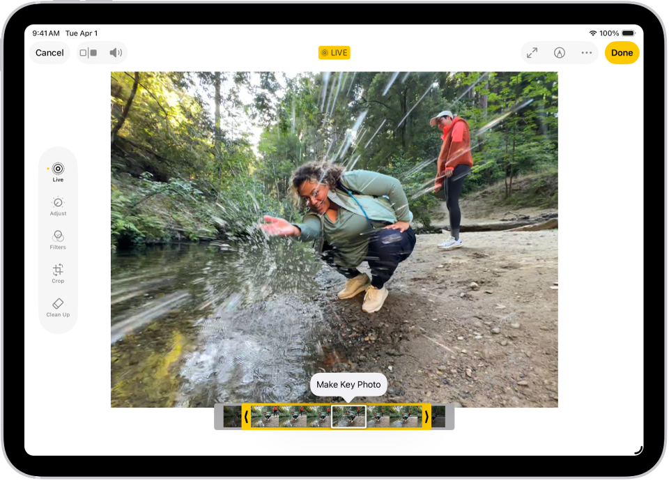 A Live Photo is in the center of the Edit screen in the Photos app. The frame viewer is across the bottom of the video and a yellow outline is around the selected frames to include in the edited Live Photo; a single frame is selected to make key photo. The editing tools are on the left side of the screen: from the top to bottom, Live Photo, Adjust, Filters, and Crop. Live Photo is selected.