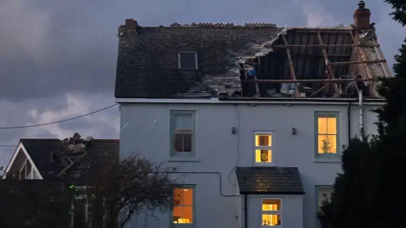 A house with part of the roof fallen through