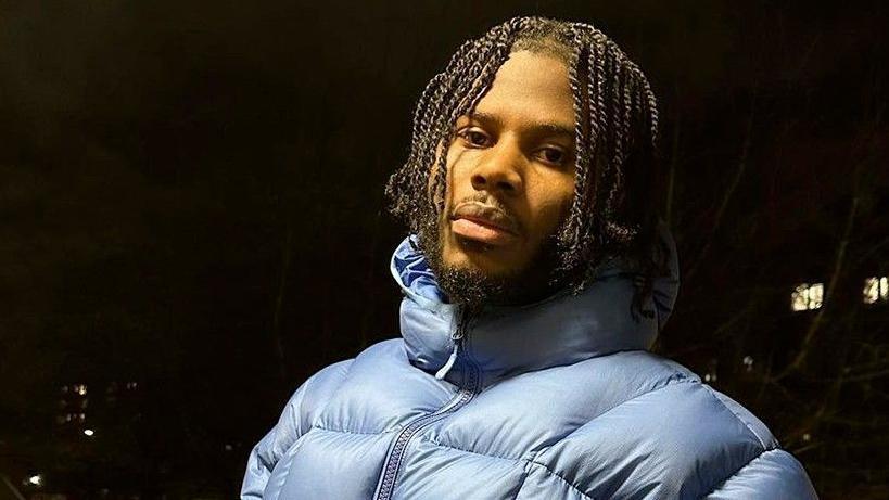 Jim Legxacy pictured outdoors at night in a light blue puffa jacket